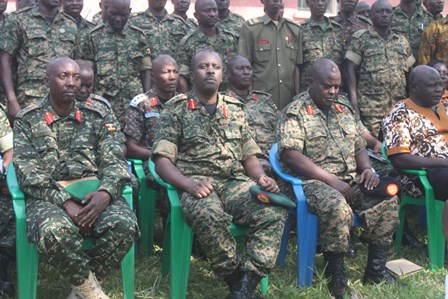 Left to Right Col Bamwiseki new Commander 4th Division CDF Gen Muhoozi Brig Kanyesigye and Gulu RDC Maj Santos Okot Lapolo.