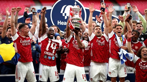 Arsenal players enjoying FA Cup victories. Courtesy photo.