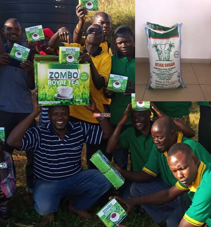 Edwin Atukunda Beekunda and his company staff with packed Zombo Royal Tea. Inset is Atiak Sugar.