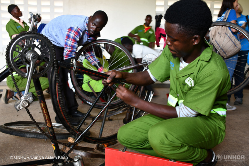 Youth assembles bicycles. Photo by Wtachdog Uganda.