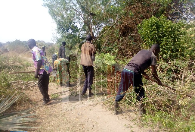 Why have angry Amolatar villagers initiated road repairs?